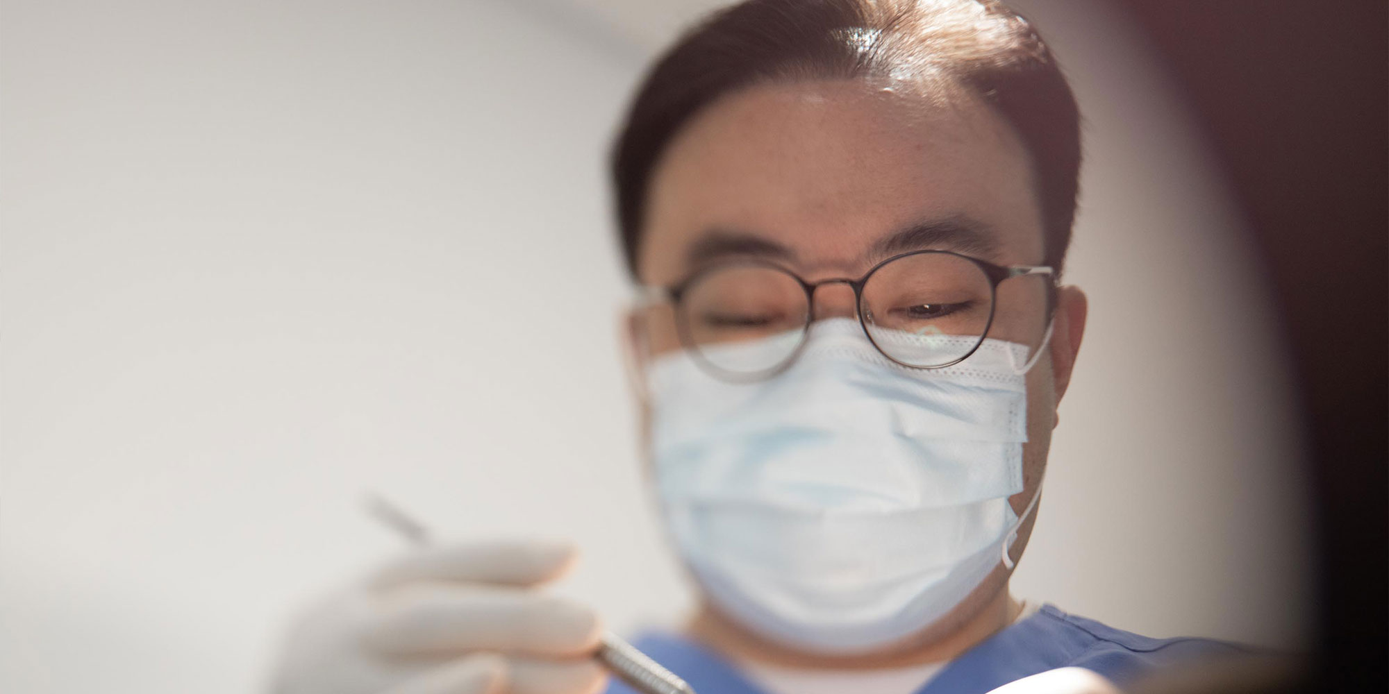 doctor performing guided dental implant surgery with patient